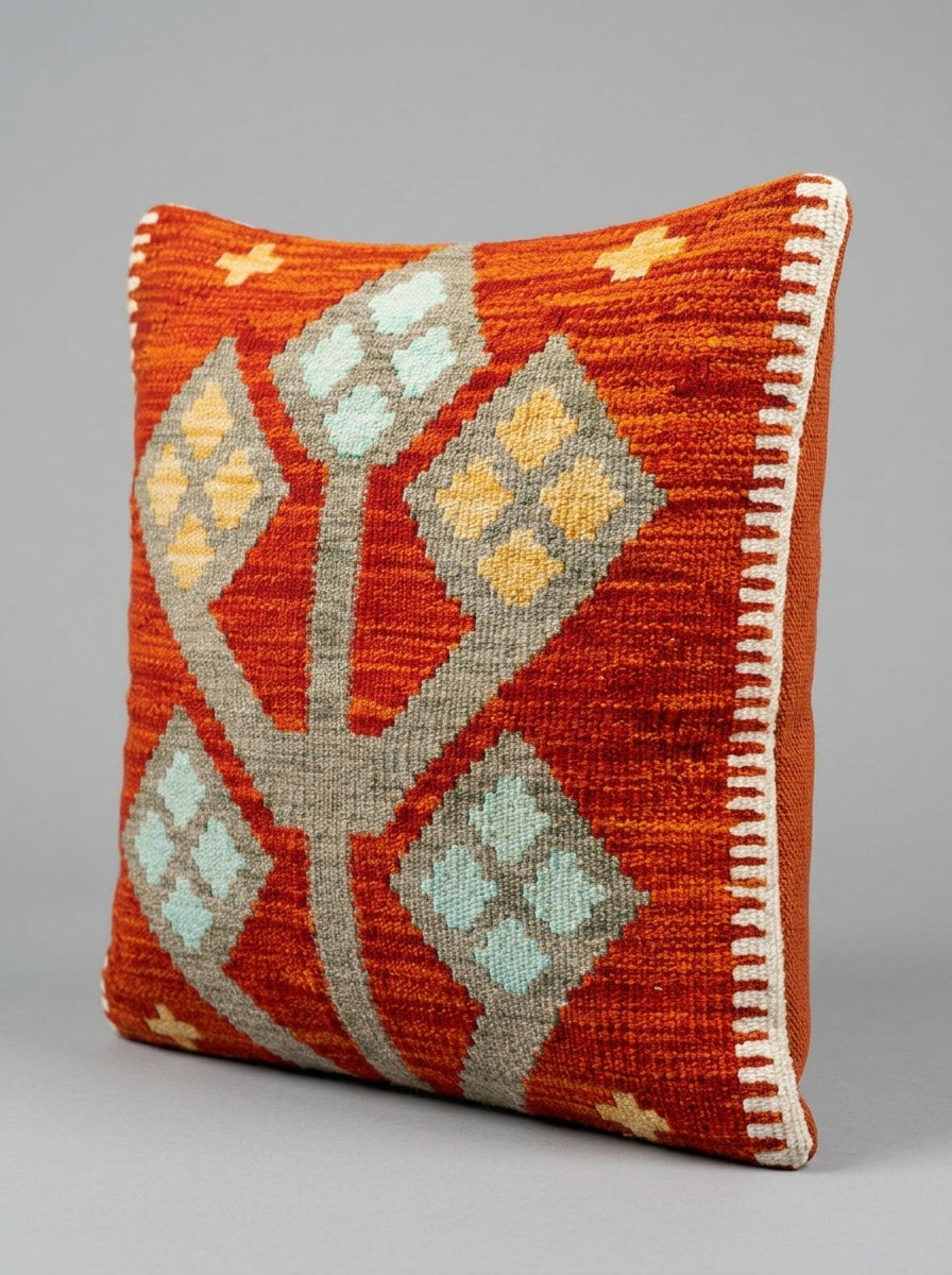 Colorful Kilim cushion by eastofhere with traditional geometric patterns, featuring vibrant woven fabric and plush filling.