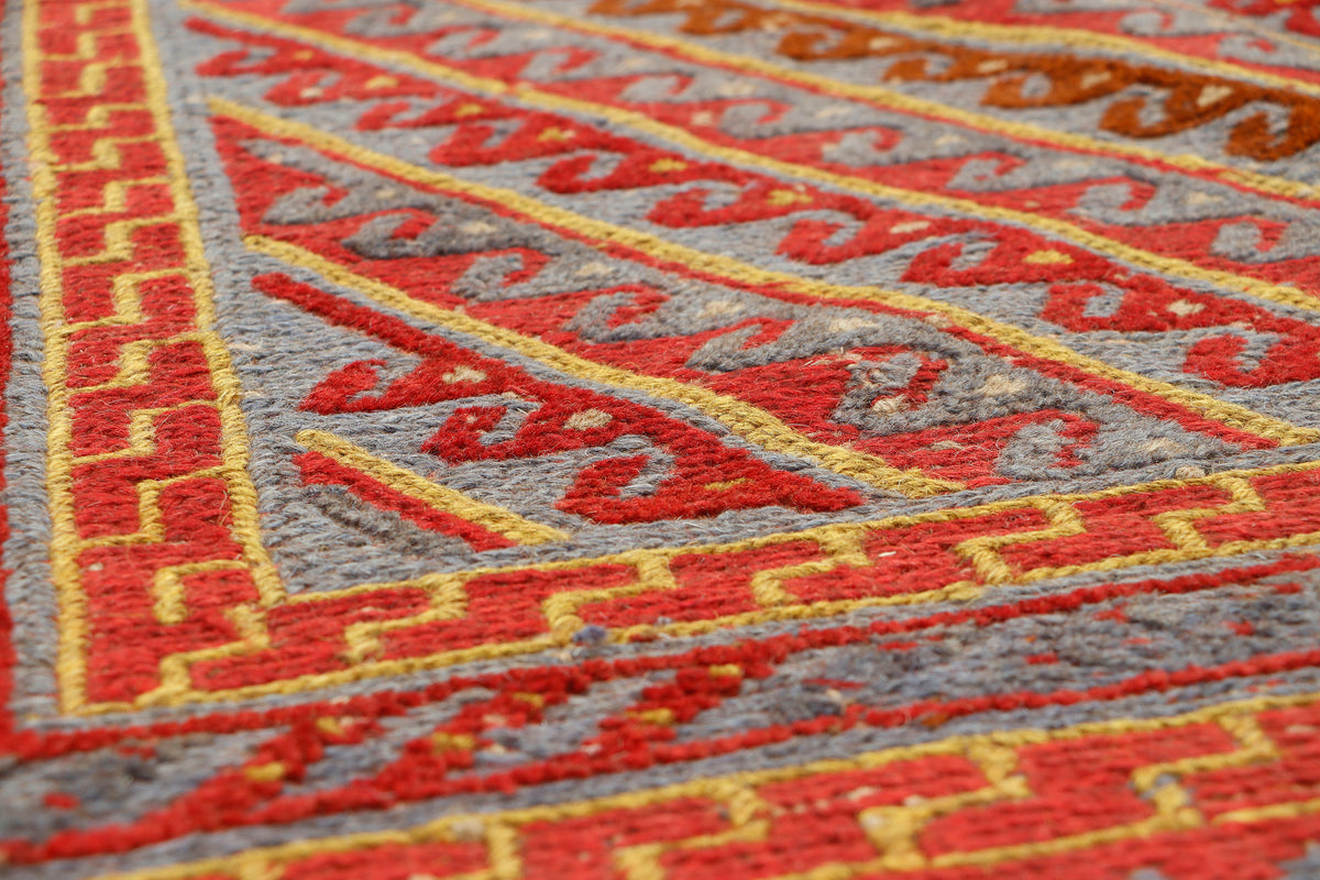 Afghan Meshwani rug from eastofhere with intricate geometric patterns in earthy tones, measuring 125 by 118 centimeters.