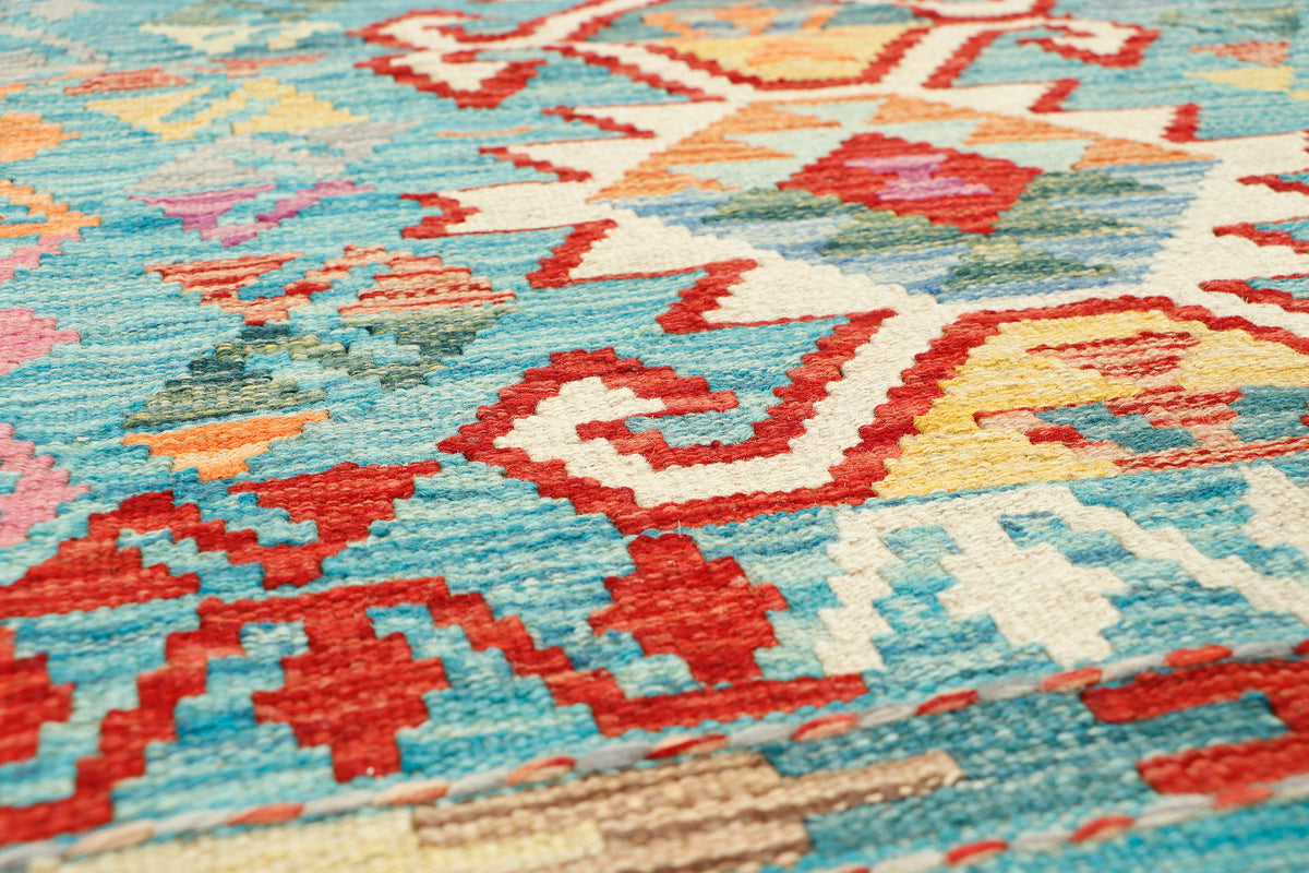 Afghan Kilim rug by eastofhere, 119x80cm, featuring traditional geometric patterns and vibrant colors, woven textile for home decor.