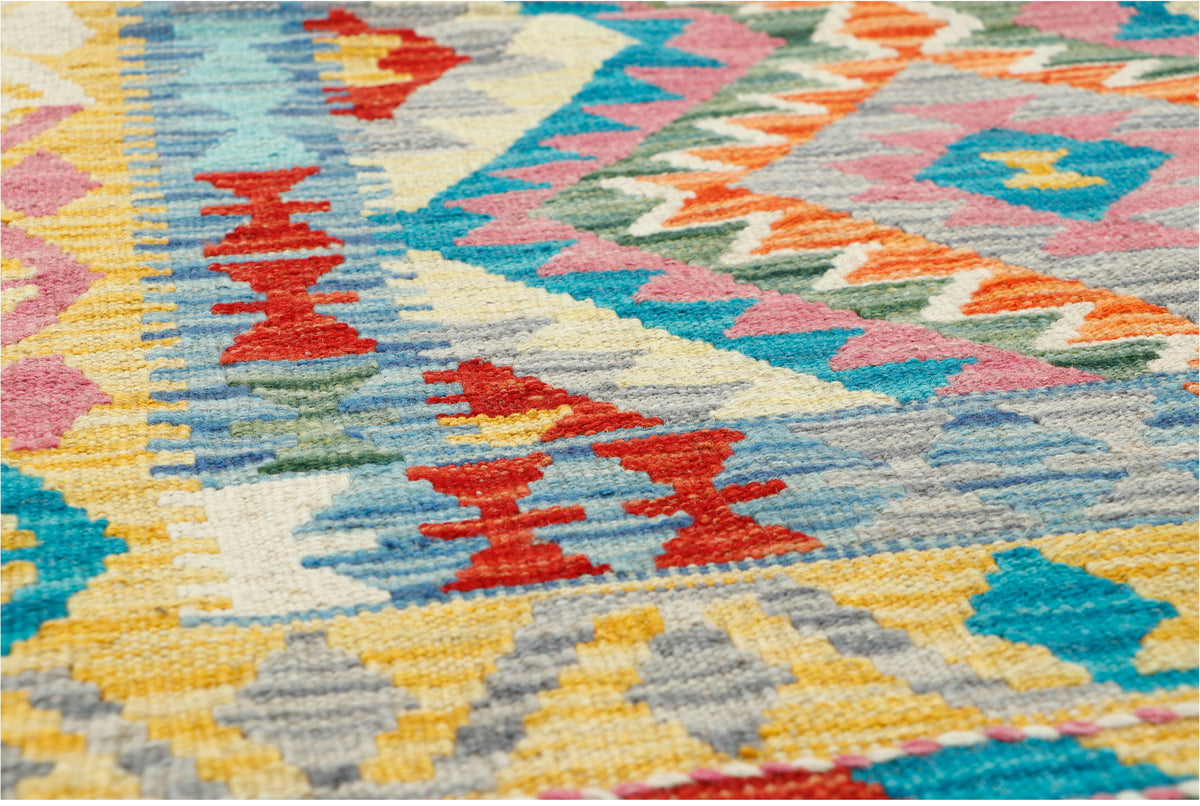 Afghan Kilim rug by eastofhere, 120x87cm, featuring traditional geometric patterns and vibrant colors in a woven textile.