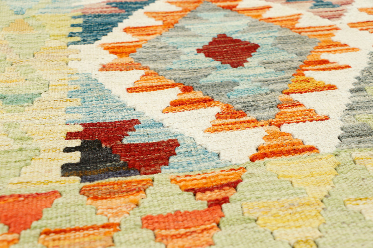 Afghan Kilim rug by eastofhere, 148x87cm, featuring traditional geometric patterns in vibrant colors on woven textile.