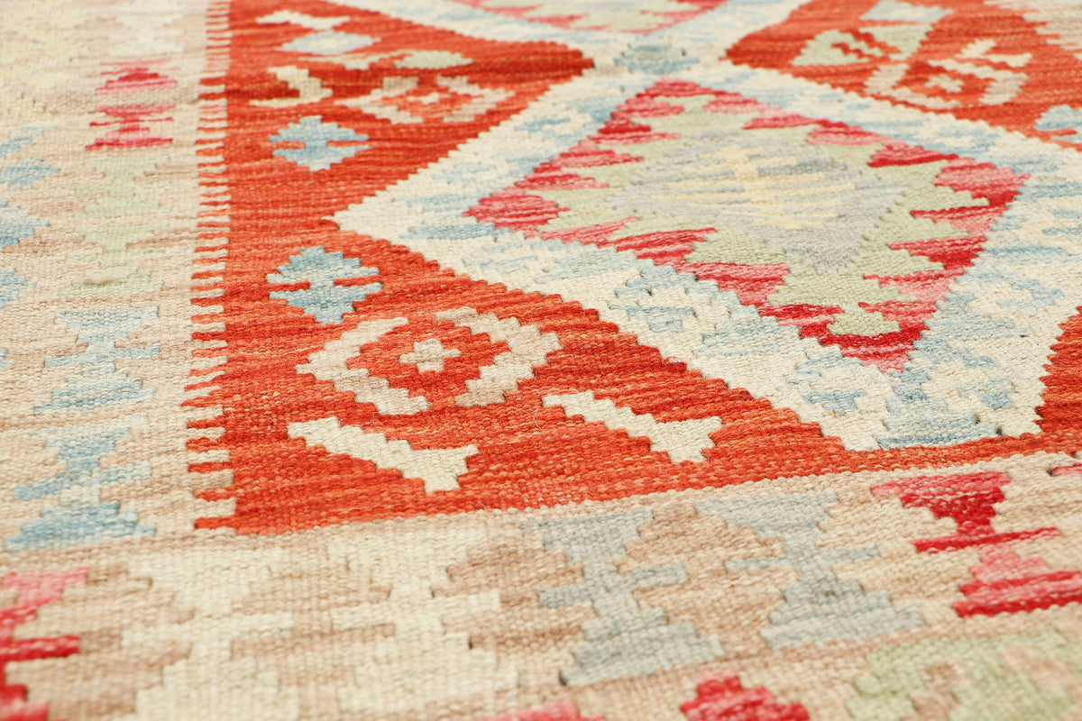 Afghan Kilim rug by eastofhere, 113x77cm, featuring traditional geometric patterns and vibrant woven design.