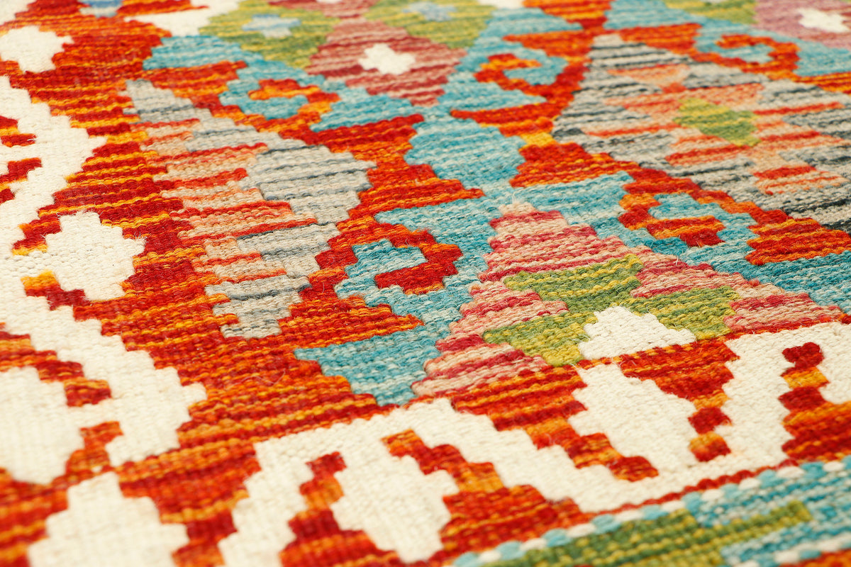 Afghan Kilim runner rug by eastofhere, 146 x 62cm, featuring traditional geometric patterns and vibrant colors.