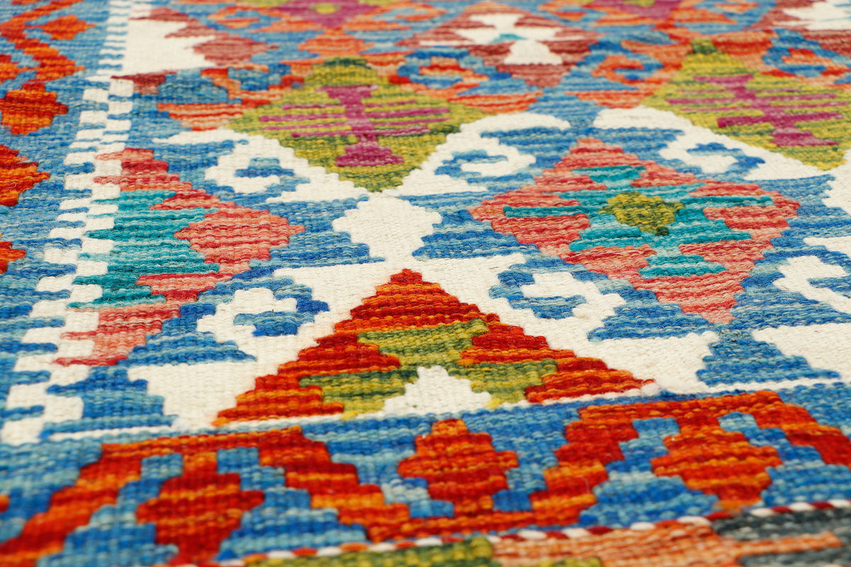 Afghan Kilim runner rug by eastofhere, 150cm x 63cm, featuring traditional geometric patterns and vibrant colors.