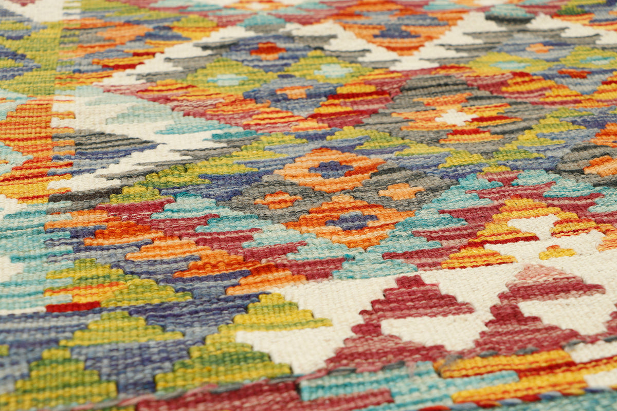 Afghan Kilim runner rug by eastofhere, 145cm long and 59cm wide, featuring traditional geometric patterns and vibrant colors.