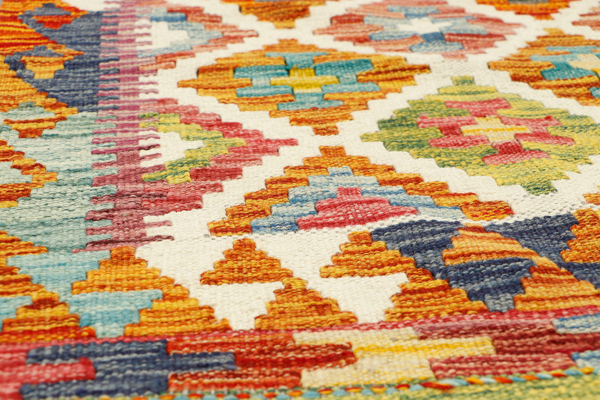 Afghan Kilim runner rug by eastofhere, 150x64cm, featuring traditional geometric patterns in vibrant colors on woven fabric.