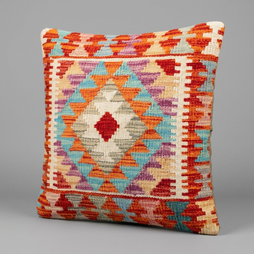 Colorful kilim cushion by eastofhere featuring traditional woven patterns and vibrant geometric designs.