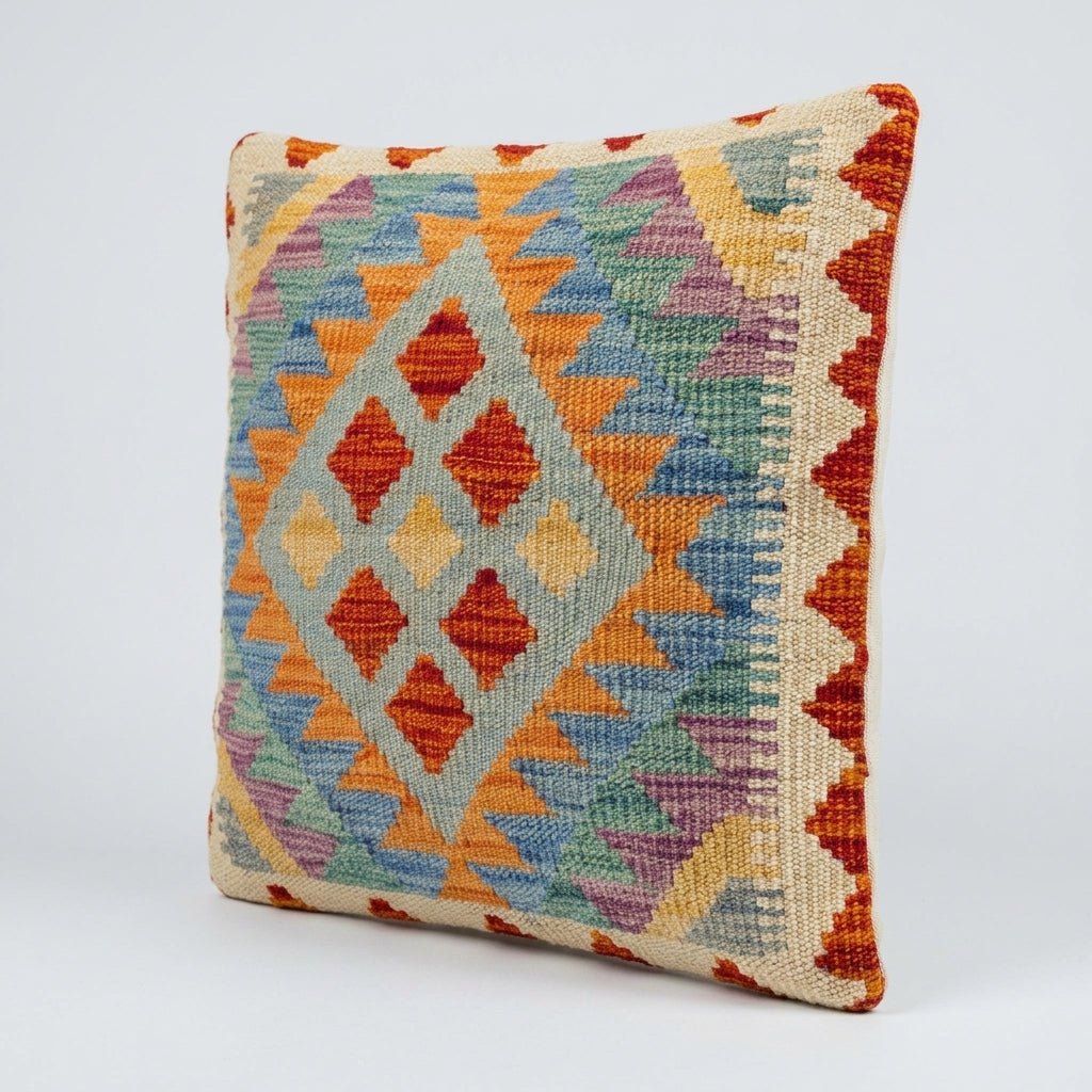Colorful Kilim cushion from eastofhere featuring traditional woven patterns and vibrant textile details.