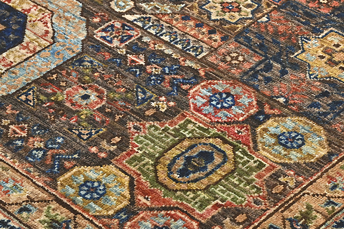 Close-up of a patterned rug with intricate designs.