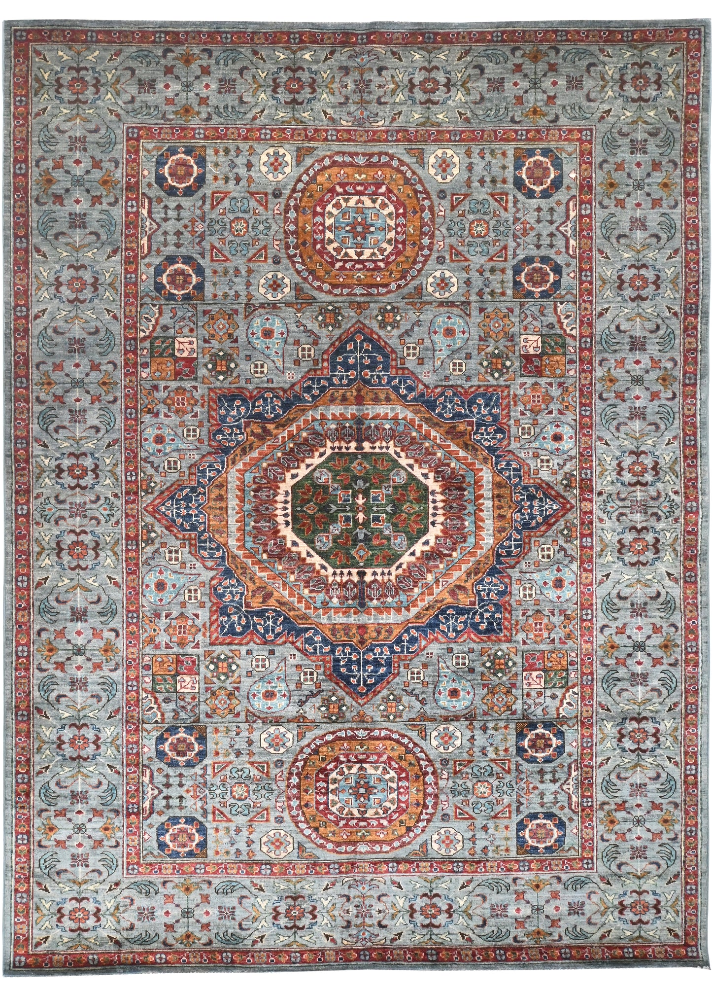 Decorative rug with intricate geometric pattern on a multicolor background