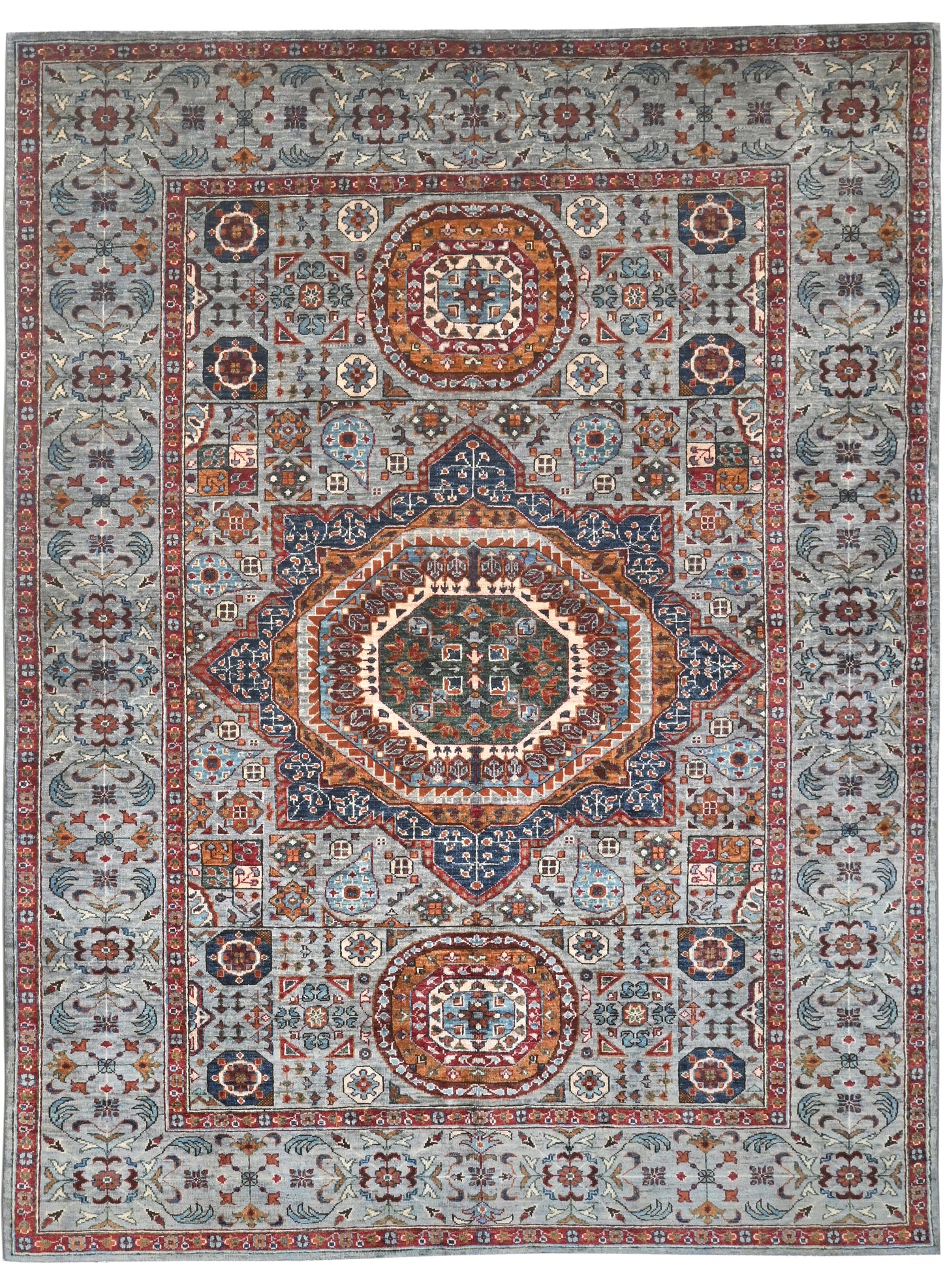 Decorative rug with intricate patterns and colors on a plain background