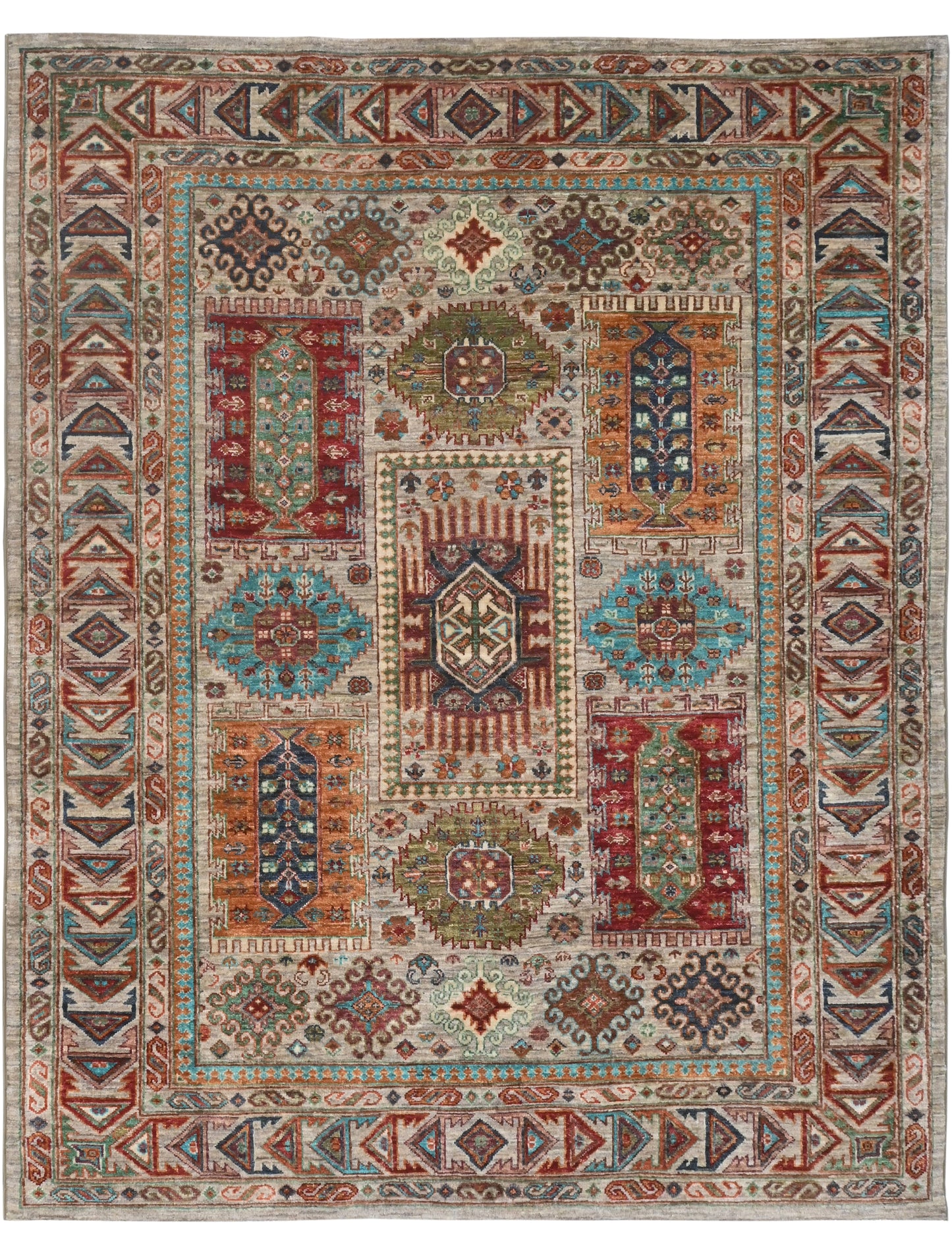 Decorative rug with intricate patterns in red, blue, and beige on a plain background
