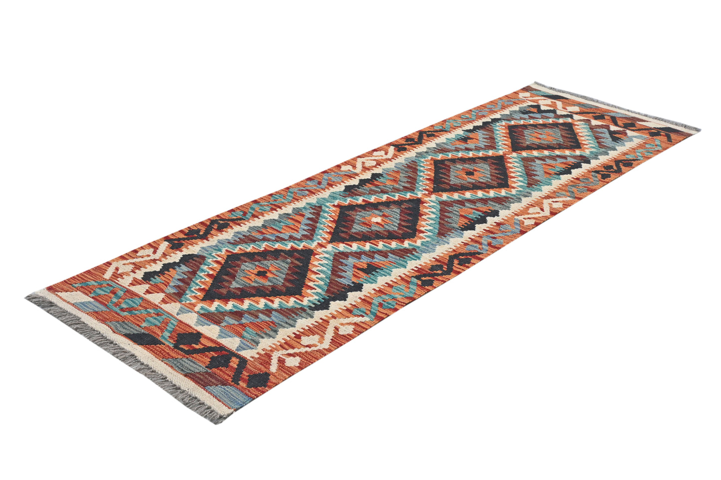 Patterned rug with geometric design on a white background