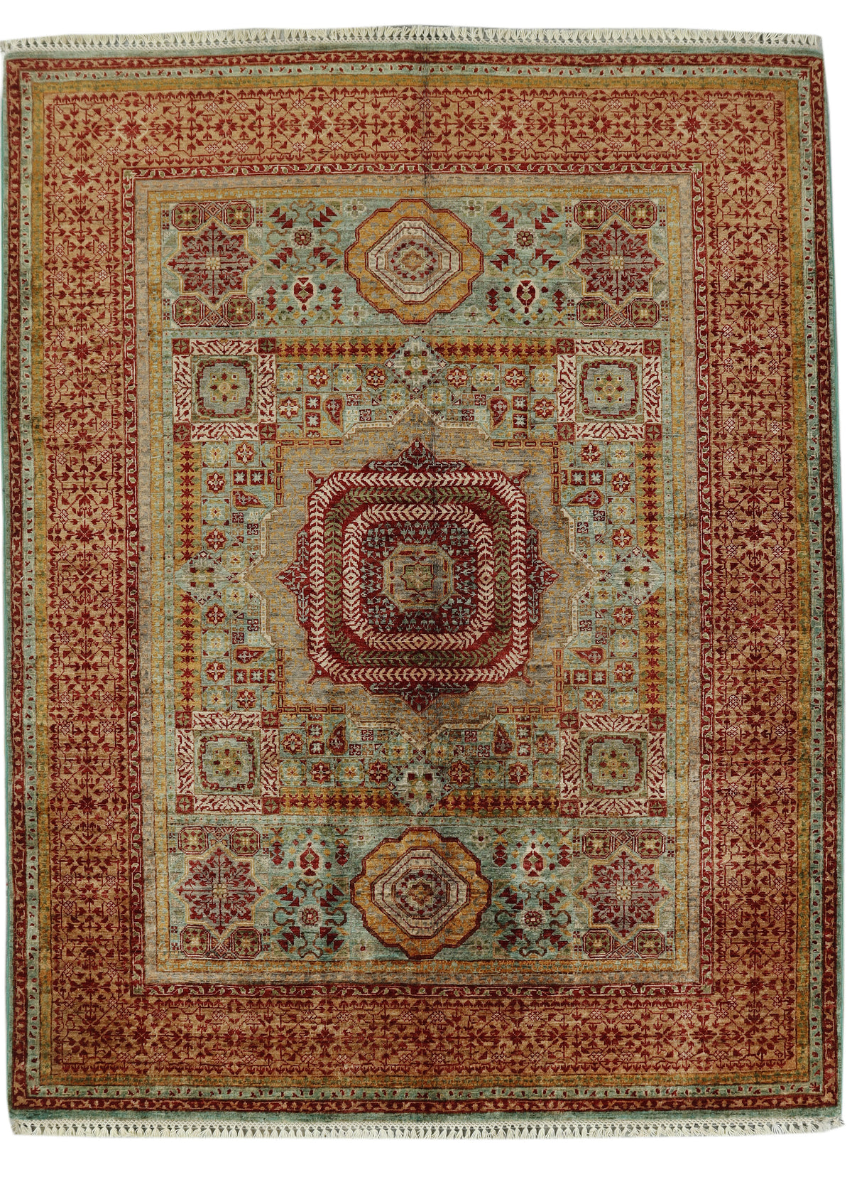 A traditional oriental area rug with a complex geometric and floral pattern, featuring a central medallion, multiple borders, and fringed edges.