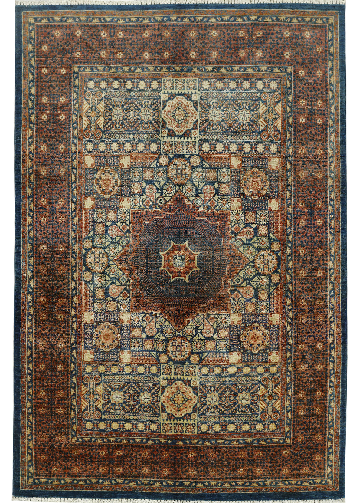 A traditional oriental-style area rug with an intricate geometric pattern, featuring a central medallion and multiple borders in shades of dark blue, rust brown, beige, and cream.