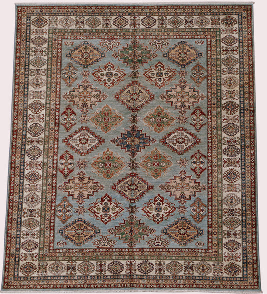 Afghan Kazak rug by eastofhere with intricate geometric patterns in warm earthy tones, measuring 302 x 253 cm.