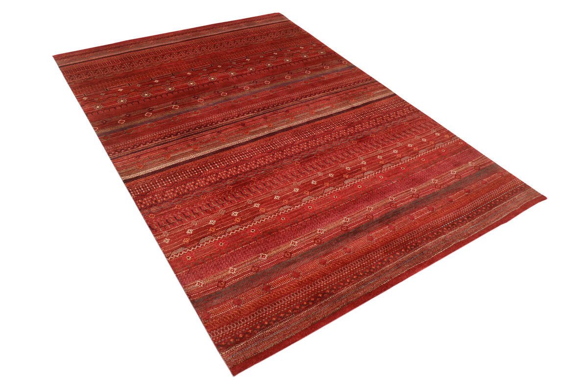 Afghan Gabbeh rug by eastofhere showcasing bold geometric designs and warm earthy tones, measuring 253 by 173 centimeters.