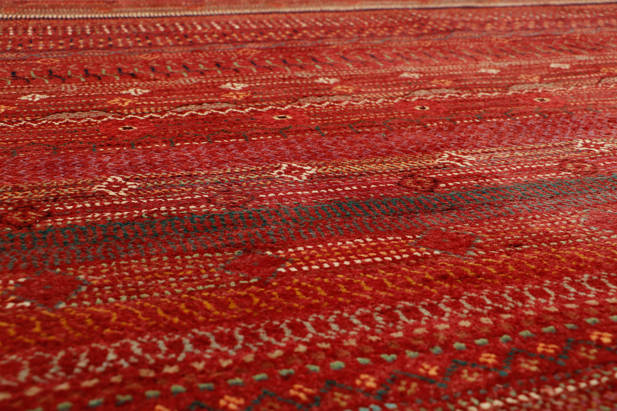 Afghan Gabbeh rug by eastofhere, measuring 253x173cm, with traditional geometric designs and warm earthy colors, handwoven textile.