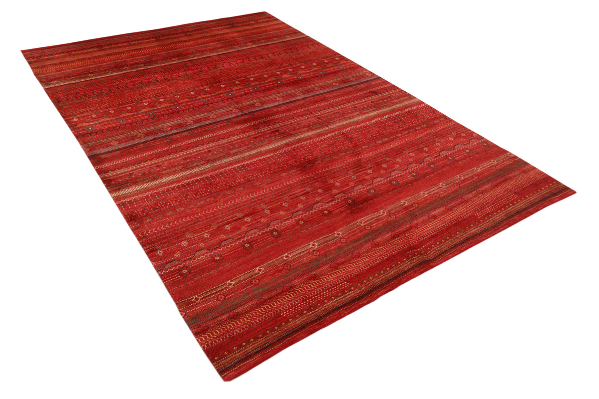 Afghan Gabbeh rug by eastofhere with geometric motifs and earthy colors, measuring 299x206cm, showcasing traditional craftsmanship.