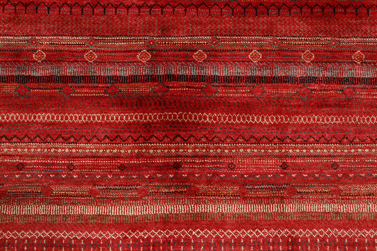 Afghan Gabbeh rug by eastofhere, measuring 299x206cm, showcasing vibrant geometric designs and a plush woven wool surface.
