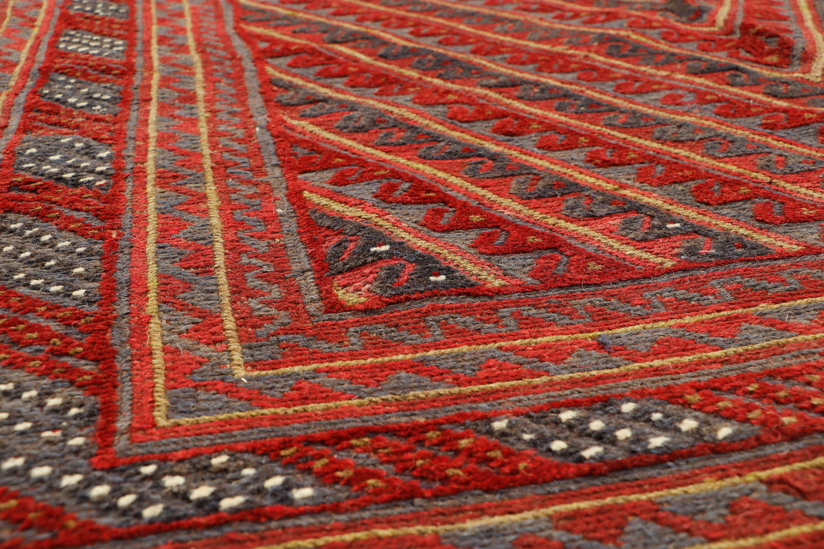 Afghan Meshwani rug by eastofhere with intricate geometric patterns, measuring 187x148cm, showcasing traditional craftsmanship.