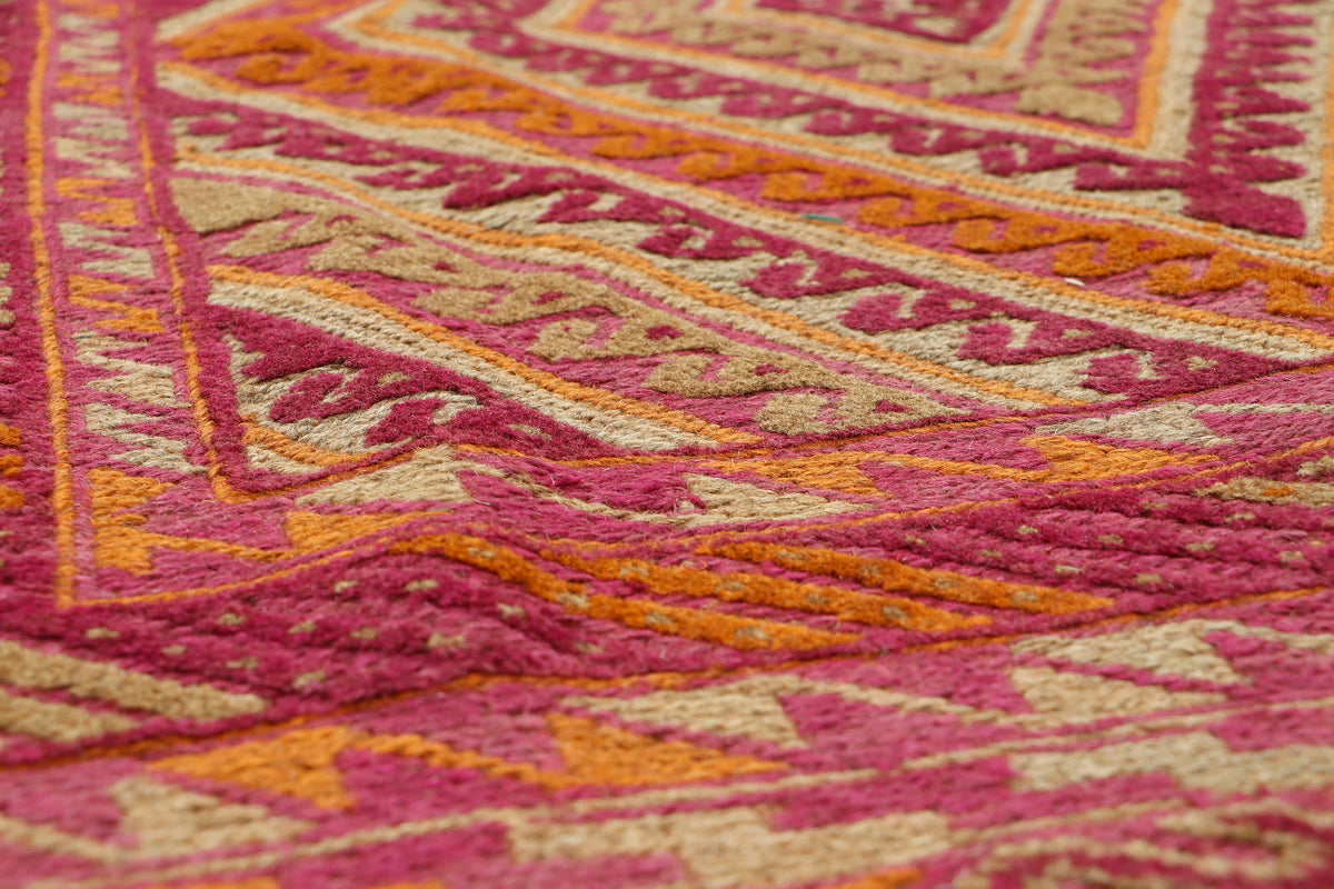 Afghan Meshwani rug from eastofhere featuring intricate geometric patterns in earthy tones, measuring 127x103cm.