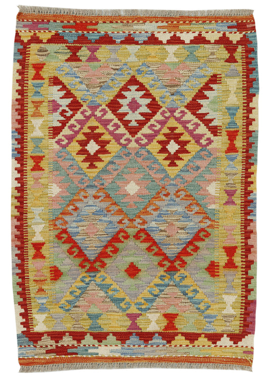 Colorful Afghan Kilim rug by eastofhere, 116x82cm, featuring traditional geometric patterns and vibrant woven design.