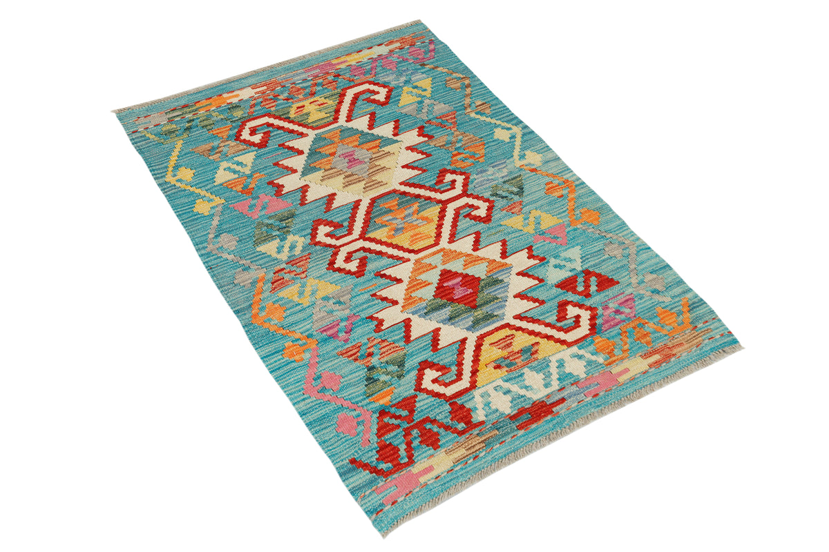 Afghan Kilim rug by eastofhere, 119x80cm, featuring traditional geometric patterns and vibrant colors on woven textile.