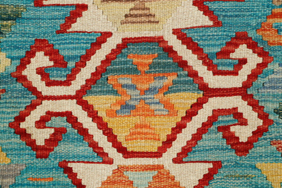 Afghan Kilim rug from eastofhere with geometric patterns in earthy tones, measuring 119 x 80cm, showcasing traditional woven design.