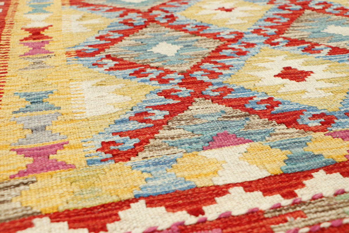 Afghan Kilim rug by eastofhere featuring traditional geometric patterns in vibrant colors, measuring 117x80cm.