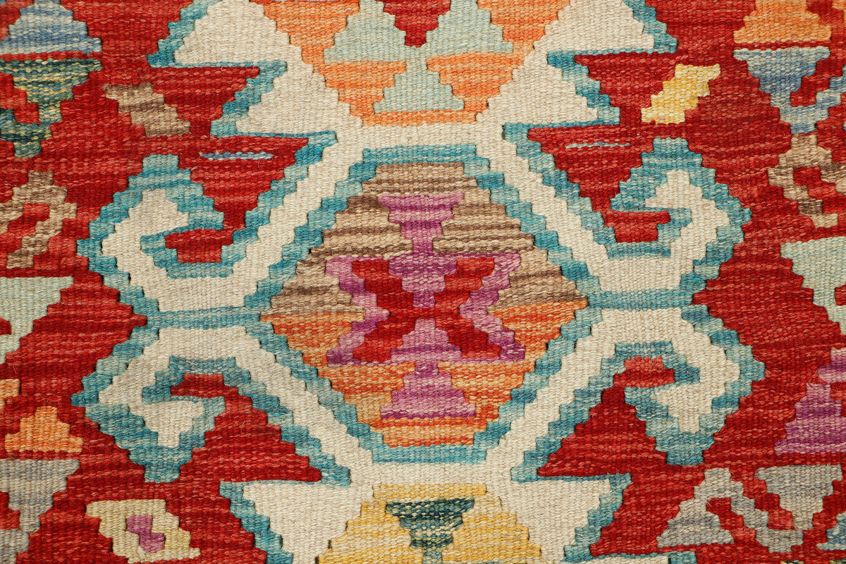 Afghan Kilim rug from eastofhere, 118x82cm, featuring traditional geometric patterns and vibrant colors, handcrafted textile decor.