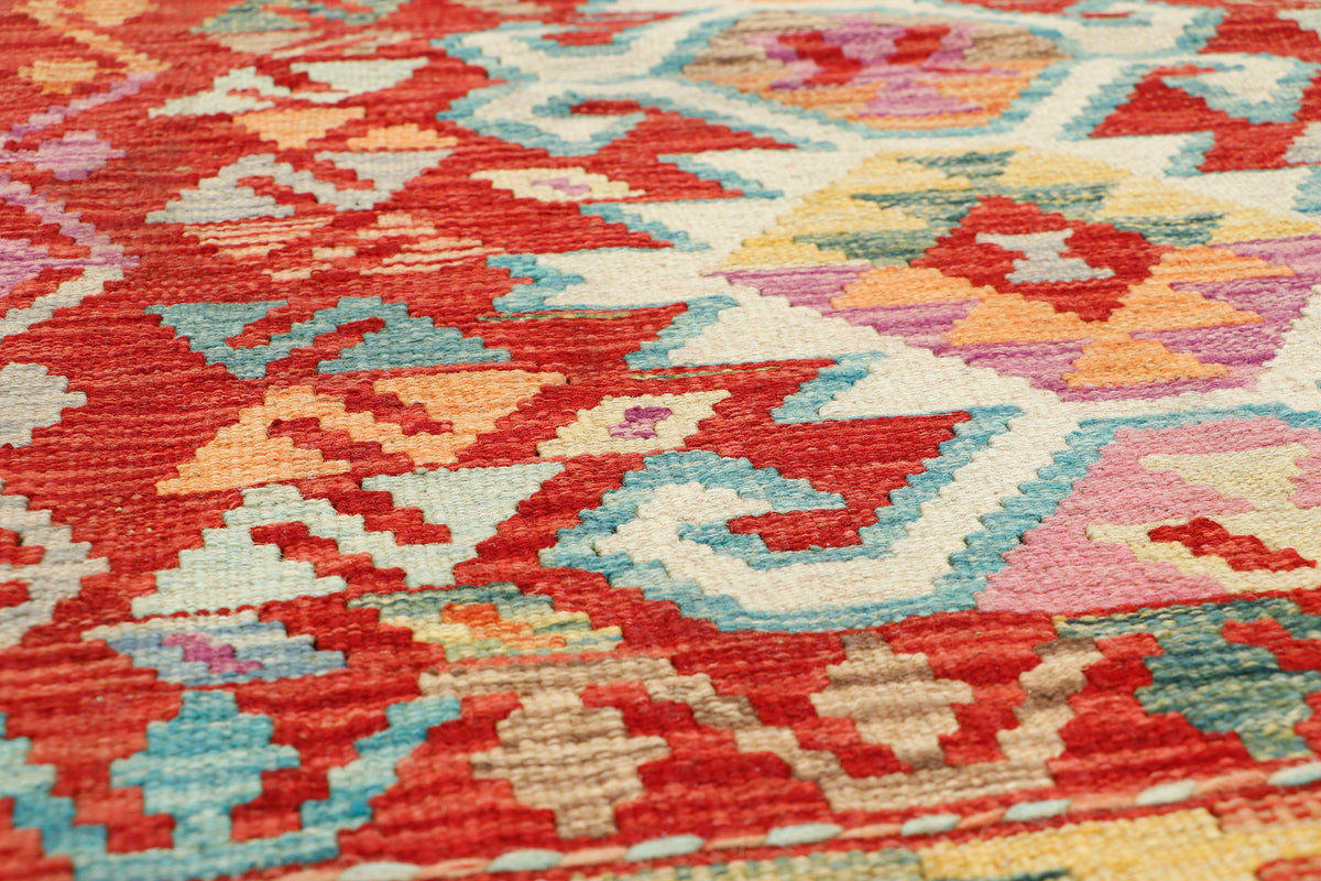 Afghan Kilim rug by eastofhere, 118x82cm, featuring traditional geometric patterns in vibrant colors, showing detailed woven texture.