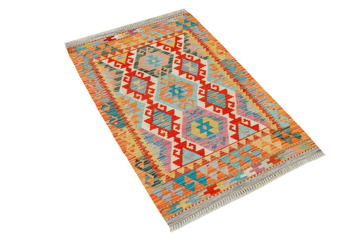 Afghan Kilim rug by eastofhere, 127x81cm, featuring traditional geometric patterns and vibrant colors on woven textile.