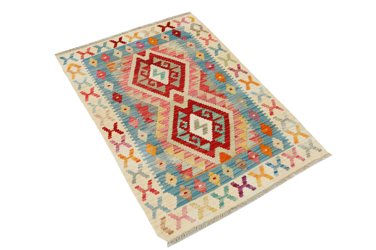 Afghan Kilim rug by eastofhere, 116x80cm, showing intricate geometric patterns and vibrant earthy tones on woven fabric.