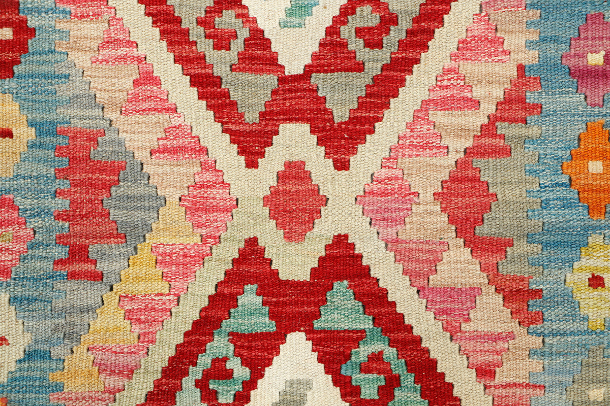 Afghan Kilim rug by eastofhere, 116x80cm, featuring traditional geometric patterns and vibrant earthy colors.