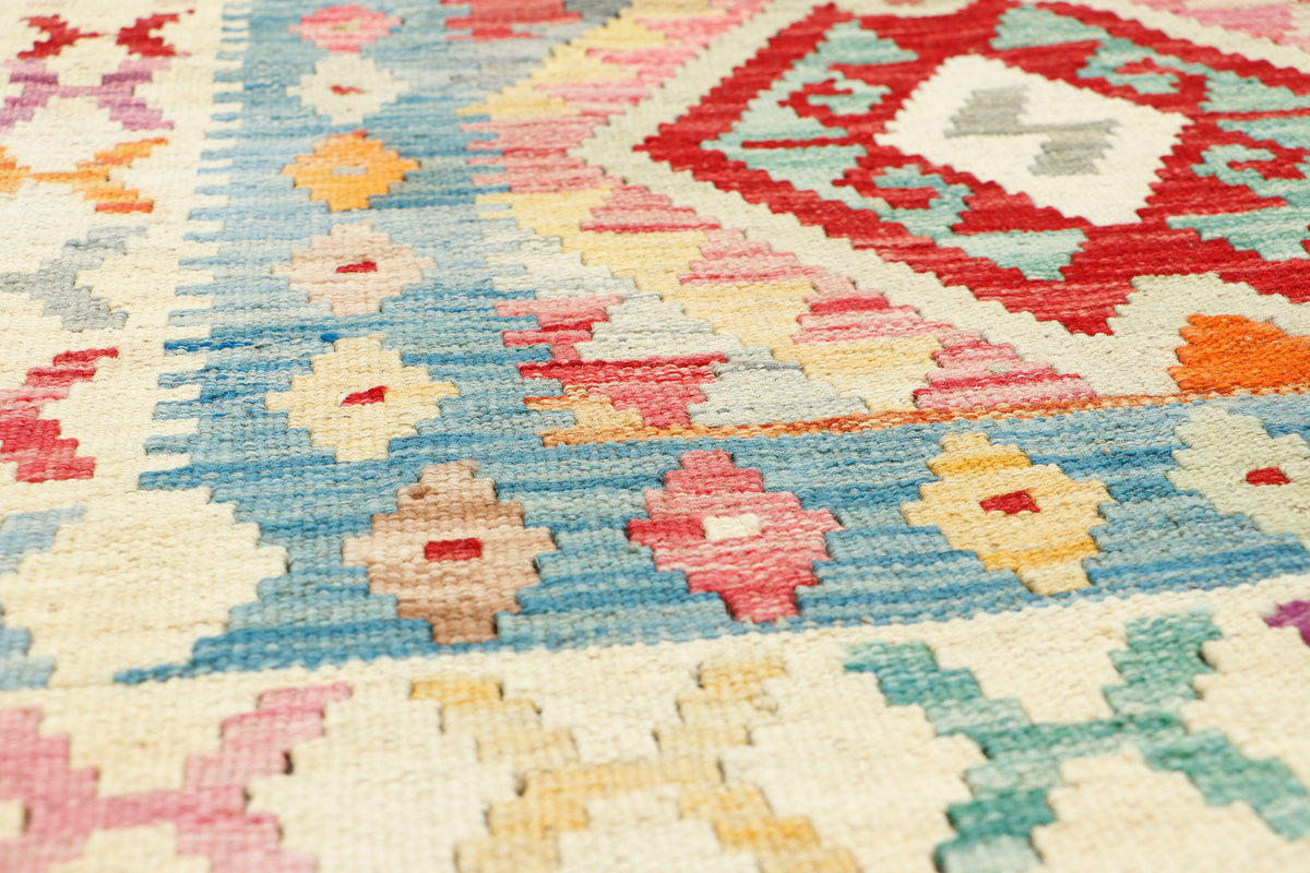 Afghan Kilim rug by eastofhere, 116x80cm, featuring traditional geometric patterns with vibrant colors and intricate woven design.