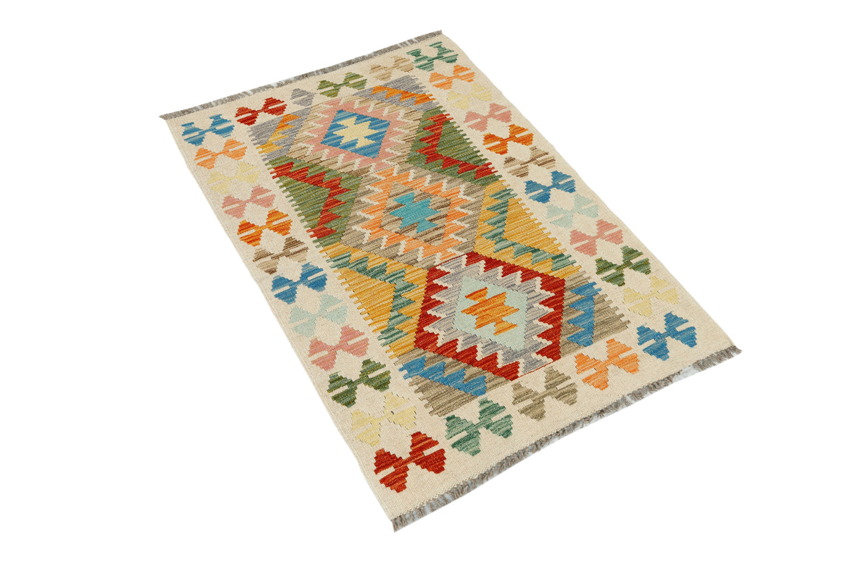 Colorful Afghan Kilim rug by eastofhere, 131x90cm, featuring traditional geometric patterns and vibrant woven textile design.