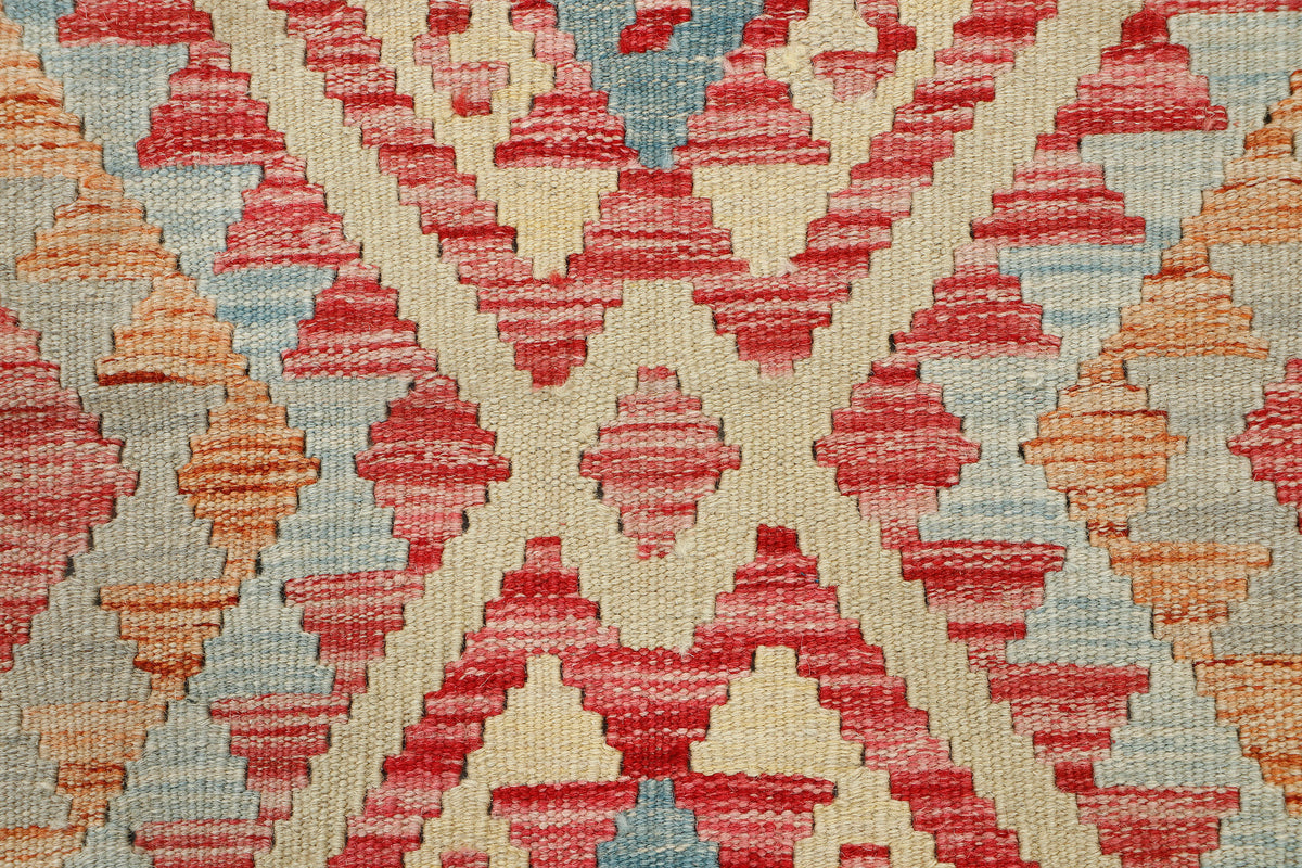 Afghan Kilim rug by eastofhere, 110x75cm, featuring traditional geometric patterns in vibrant colors, woven textile decoration.
