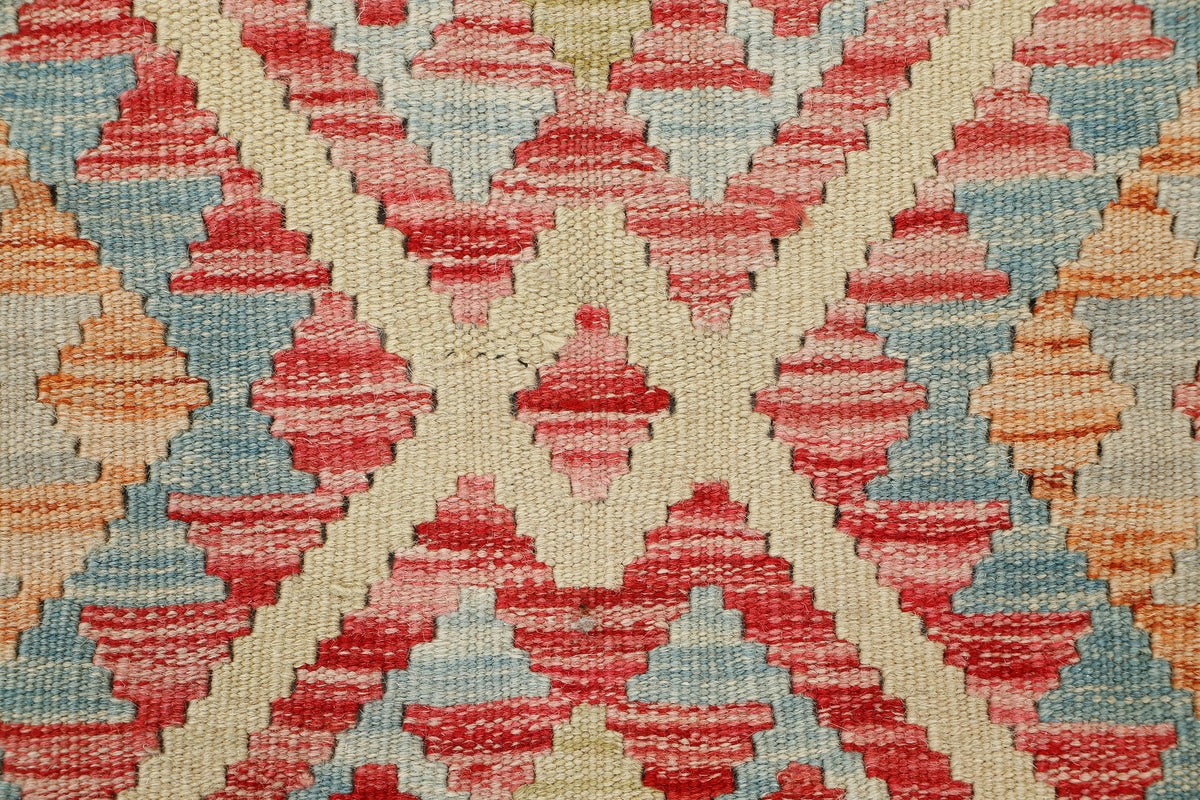 Afghan Kilim rug by eastofhere featuring traditional geometric patterns in vibrant colors, measuring 105x76cm.