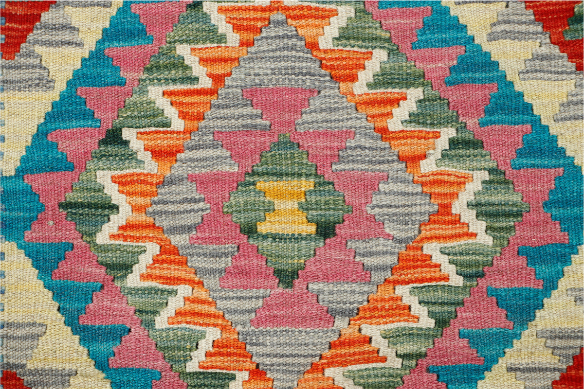 Afghan Kilim rug by eastofhere, 120x87cm, featuring traditional geometric patterns in vibrant colors on a woven textile.