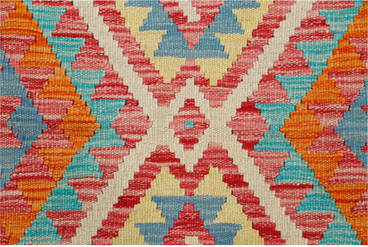 Afghan Kilim rug by eastofhere, 110x80cm, featuring traditional geometric patterns and vibrant colors on woven textile.