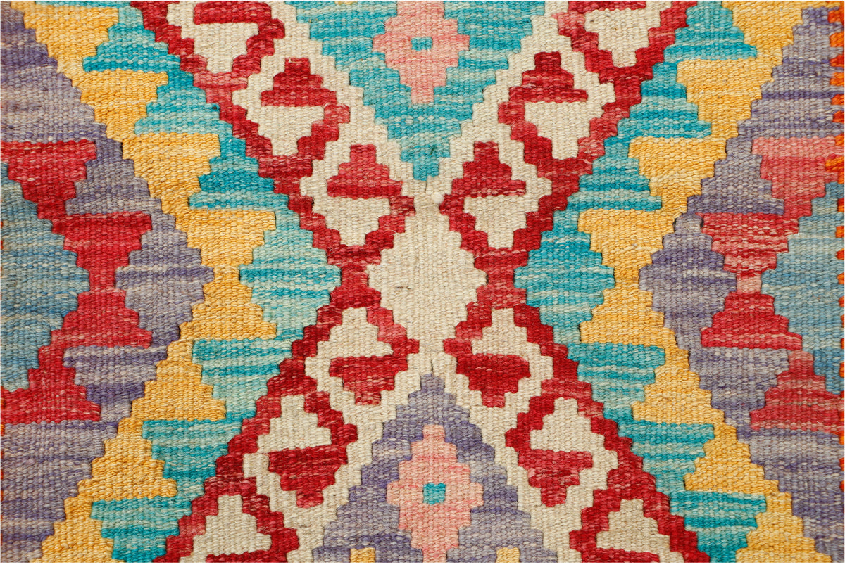 Afghan Kilim rug by eastofhere with intricate geometric patterns, vibrant colors, and traditional woven design, 123x82cm size.