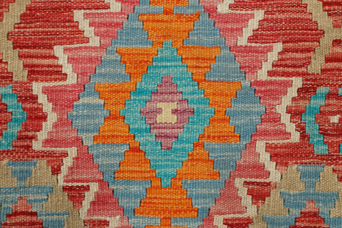 Afghan Kilim rug by eastofhere, 121x78cm, featuring traditional geometric patterns and vibrant colors on a woven textile.