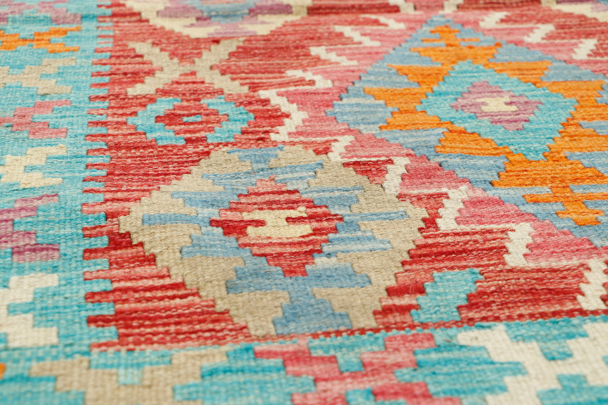 Afghan Kilim rug by eastofhere, 121x78cm, featuring traditional geometric patterns and vibrant earthy colors.