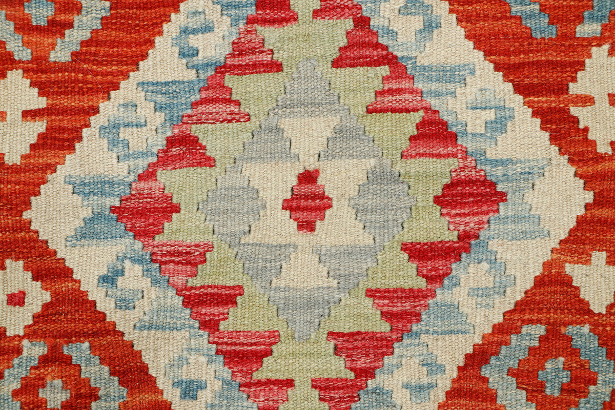 Afghan Kilim rug from eastofhere, 121x81cm, featuring vibrant geometric patterns and traditional woven design.
