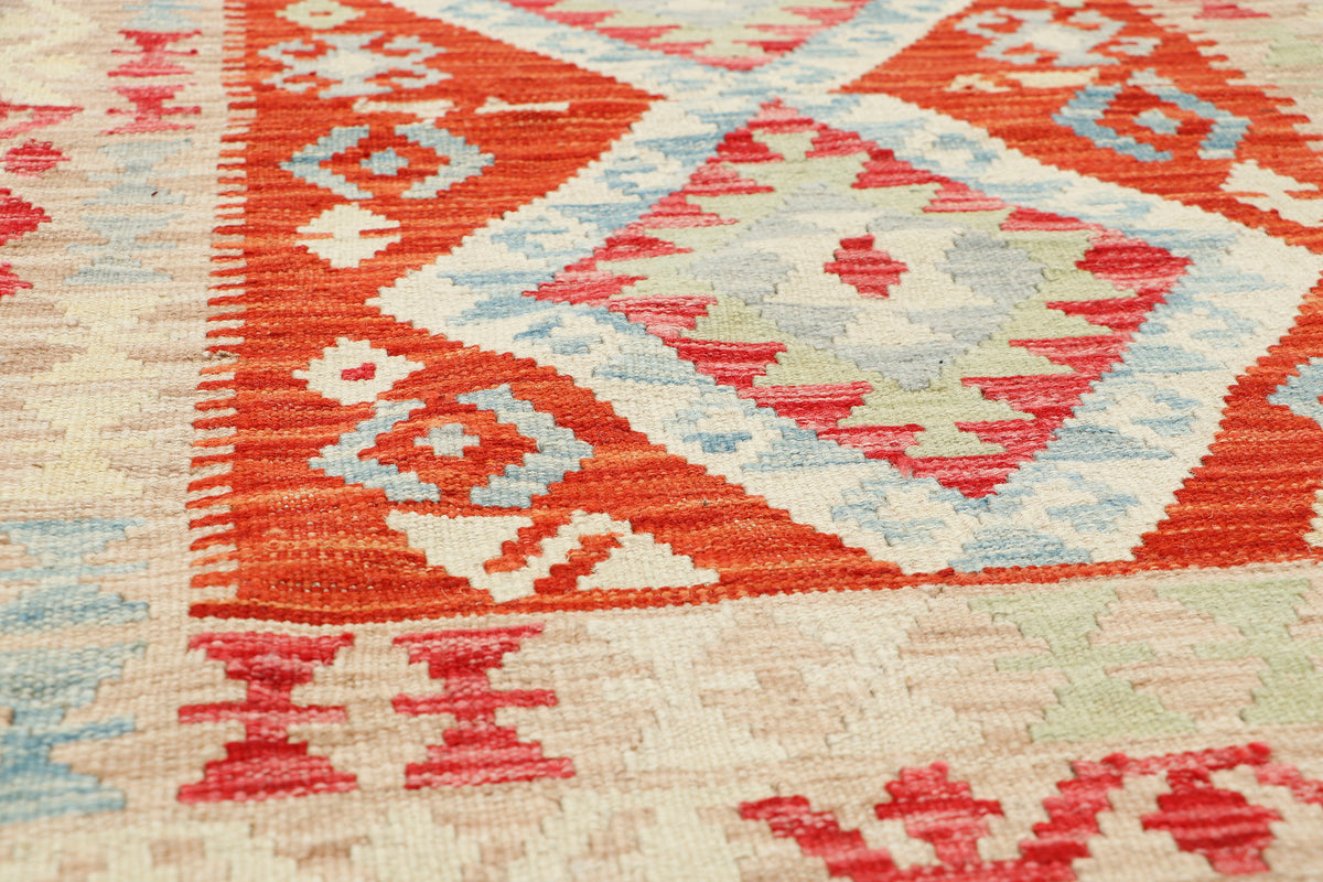 Afghan Kilim rug with geometric patterns in vibrant colors, measuring 121x81cm, crafted by eastofhere.