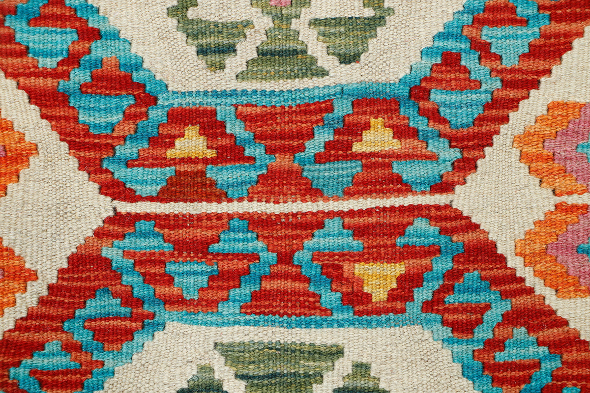 Afghan Kilim rug by eastofhere featuring intricate geometric patterns in vibrant colors, measuring 116x80cm.