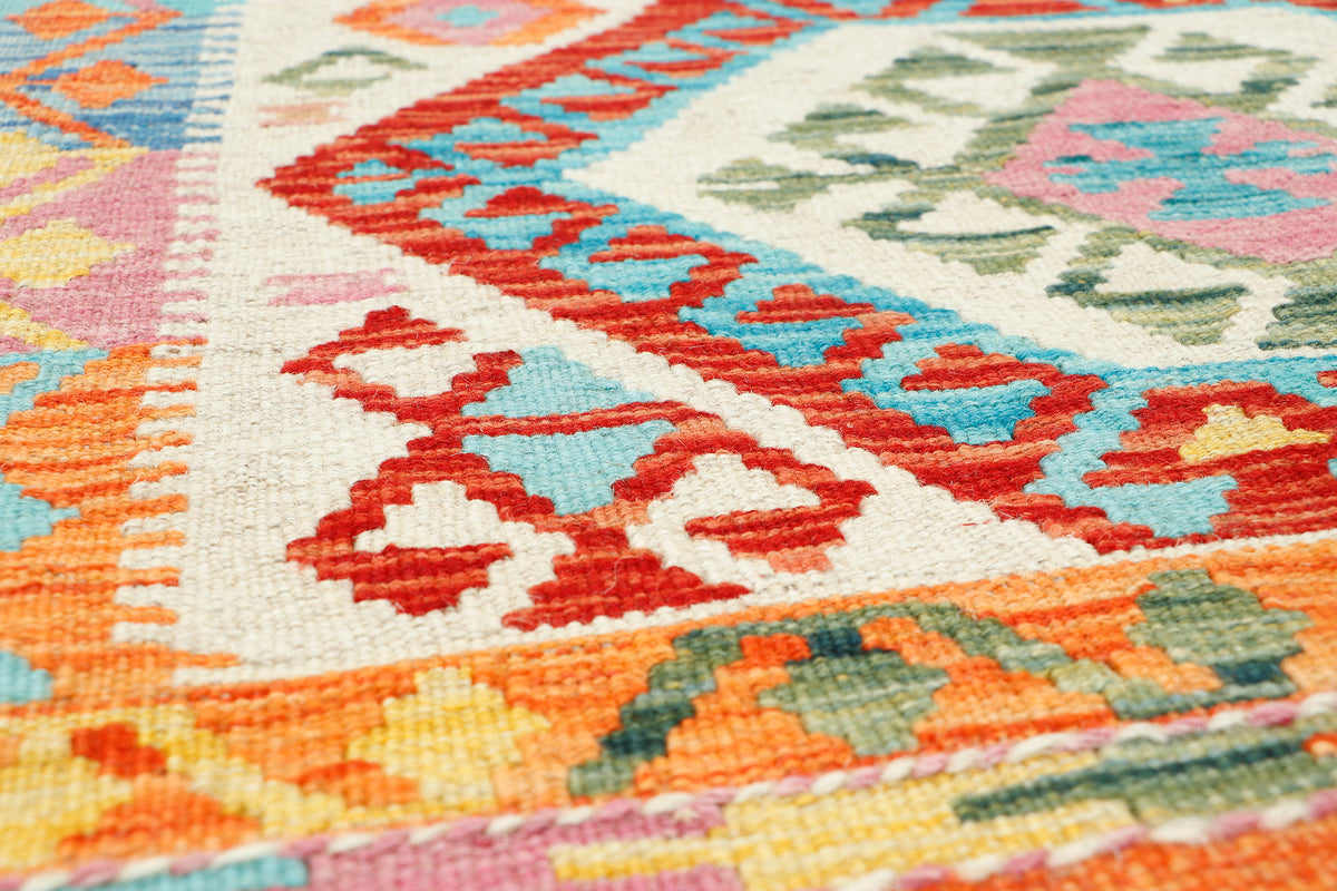 Afghan Kilim rug by eastofhere, 116x80cm, featuring traditional geometric patterns in vibrant colors.