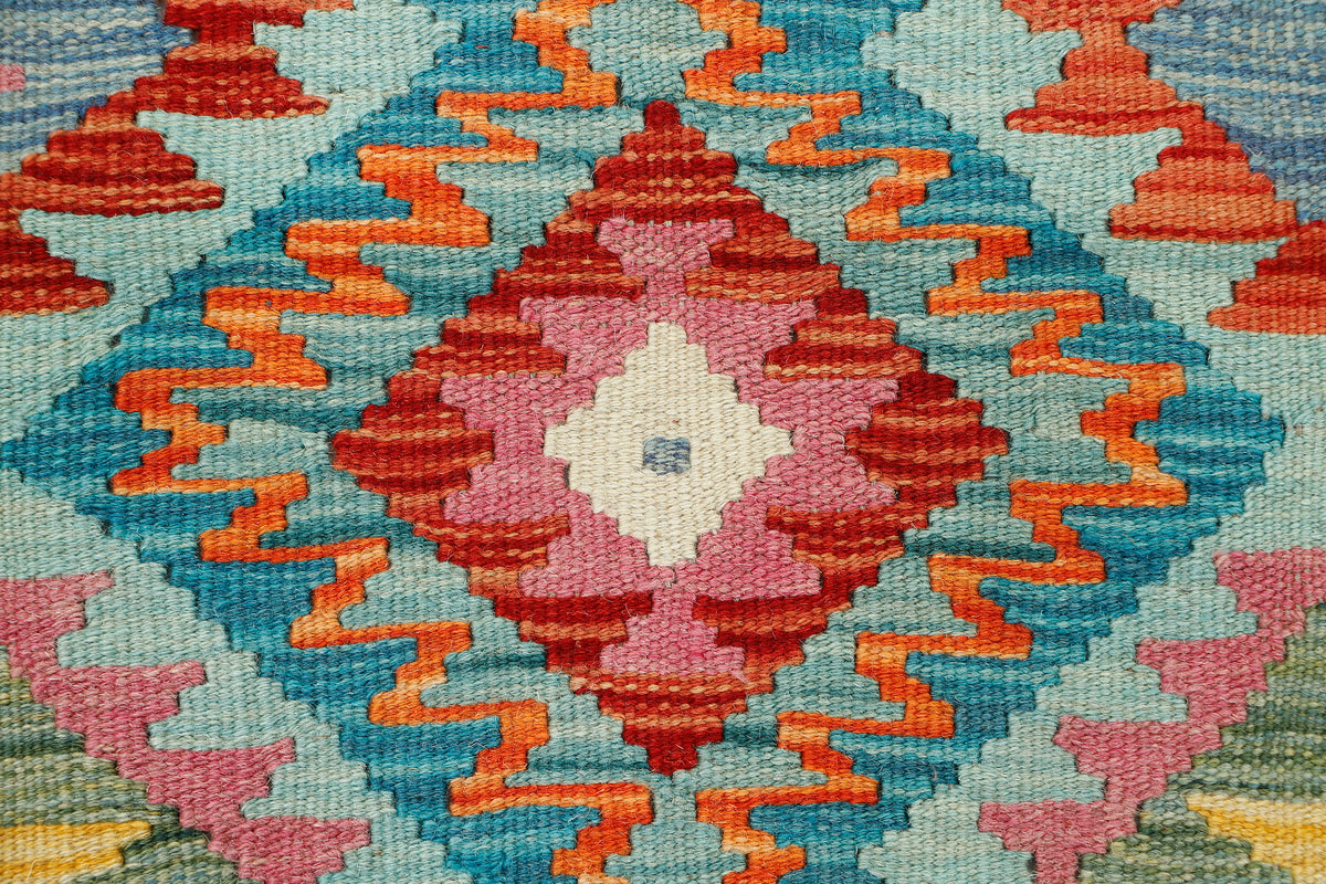 Afghan Kilim rug by eastofhere, 111x90cm, featuring traditional geometric patterns and vibrant colors, suitable for home decor.