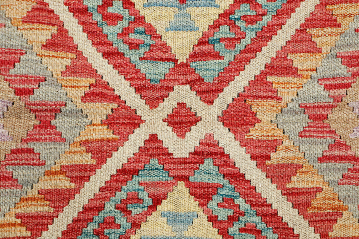 Afghan Kilim rug in vibrant geometric patterns, 112x75cm, handmade by eastofhere with traditional woven textile craftsmanship.
